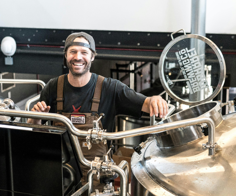 Smiling Man at a craft facility | Transworld Business Advisors